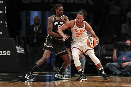May 17, 2022; Brooklyn, New York, USA;  Connecticut Sun forward Alyssa Thomas (25) moves the ball against New York Liberty forward Natasha Howard (6) in the first quarter at Barclays Center. Mandatory Credit: Wendell Cruz-USA TODAY Sports