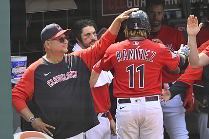 May 19, 2022; Cleveland, Ohio, USA; Cleveland Guardians third baseman Jose Ramirez (11) celebrates his RBI single with manager Terry Francona (77) in the eighth inning against the Cincinnati Reds at Progressive Field. Mandatory Credit: David Richard-USA TODAY Sports