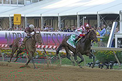 May 21, 2022; Baltimore, MD, USA; Early Voting with jockey Jose Ortiz wins the Preakness Stakes ahead of Epicenter (left) at Pimlico Race Course. Mandatory Credit: Mitch Stringer-USA TODAY Sports