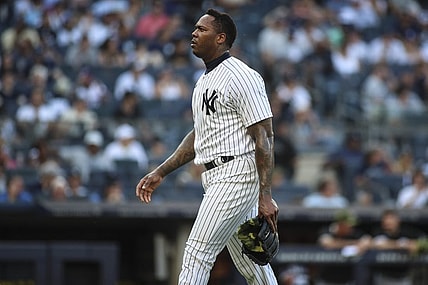 May 22, 2022; Bronx, New York, USA;  New York Yankees relief pitcher Aroldis Chapman (54) walks off the mound in the ninth inning after blowing a save against the Chicago White Sox at Yankee Stadium. Mandatory Credit: Wendell Cruz-USA TODAY Sports