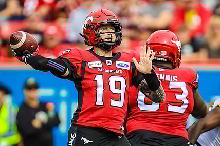 Sep 14, 2019; Calgary, Alberta, CAN; Calgary Stampeders quarterback Bo Levi Mitchell (19) throws a pass against the Hamilton Tiger-Cats in the first half during a Canadian Football League game at McMahon Stadium. Mandatory Credit: Sergei Belski-USA TODAY Sports