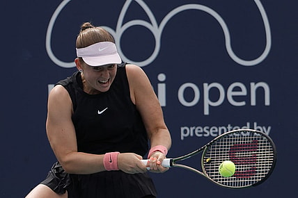 Mar 25, 2022; Miami Gardens, FL, USA; Jelena Ostapenko (LAT) hits a backhand against Shelby Rogers (USA) (not pictured) in a second round women's match in the Miami Open at Hard Rock Stadium. Mandatory Credit: Geoff Burke-USA TODAY Sports