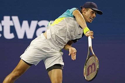 Mar 28, 2022; Miami Gardens, FL, USA; Alex de Minaur (AUS) serves against Stefanos Tsitsipas (GRE)(not pictured) in a third round men's singles match in the Miami Open at Hard Rock Stadium. Mandatory Credit: Geoff Burke-USA TODAY Sports