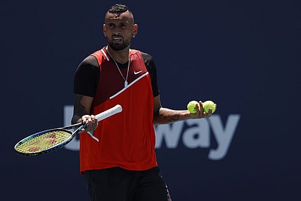 Mar 29, 2022; Miami Gardens, FL, USA; Nick Kyrgios (AUS) talks to the crowd between points against Jannik Sinner (ITA)(not pictured) in a fourth round men's singles match in the Miami Open at Hard Rock Stadium. Mandatory Credit: Geoff Burke-USA TODAY Sports