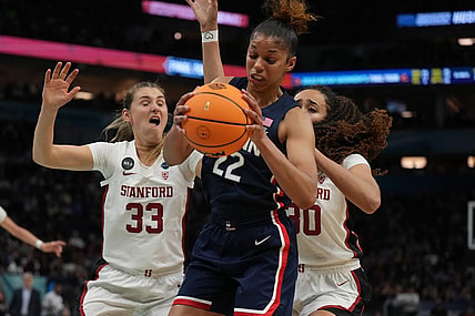 Apr 1, 2022; Minneapolis, MN, USA; UConn Huskies guard Evina Westbrook (22) battles for a rebound with Stanford Cardinal guard Hannah Jump (33) and Stanford Cardinal guard Haley Jones (30) during the second half in the Final Four semifinals of the women's college basketball NCAA Tournament at Target Center. Mandatory Credit: Kirby Lee-USA TODAY Sports