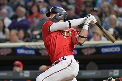 May 13, 2022; Minneapolis, Minnesota, USA; Minnesota Twins shortstop Royce Lewis (23) doubles to deep left center off Cleveland Guardians starting pitcher Aaron Civale (not pictured) during the fifth inning at Target Field. Lewis would later hit a grand slam home run in the same inning. Mandatory Credit: Jeffrey Becker-USA TODAY Sports