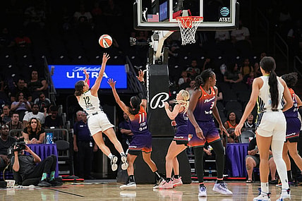 Dallas Wings guard Veronica Burton (12), left, shoots the ball while off balance during the second half against the Dallas Wings at the Footprint Center on Thursday, May 19, 2022, in Phoenix. The Mercury lost 84 to 94.

Uscp 7l2kp07z4a912iwb01rk2 Original