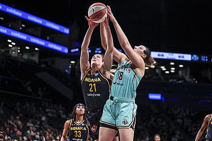 Jun 1, 2022; Brooklyn, New York, USA; Indiana Fever forward Emily Engstler (21) and New York Liberty forward Lorela Cubaj (18) fight for a rebound in the fourth quarter at Barclays Center. Mandatory Credit: Wendell Cruz-USA TODAY Sports
