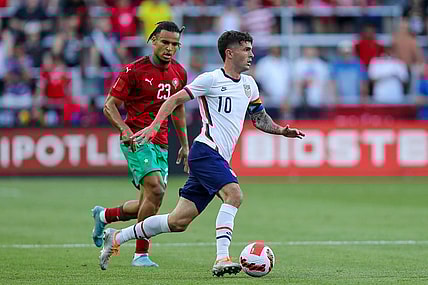 Jun 1, 2022; Cincinnati, Ohio, USA; United States forward Christian Pulisic (10) dribbles against Morocco forward Samy Mmaee (23) in the first half during an International friendly soccer match at TQL Stadium. Mandatory Credit: Katie Stratman-USA TODAY Sports