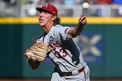 Jun 22, 2022; Omaha, NE, USA; Arkansas Razorbacks starting pitcher Hagen Smith (33) throws against the Ole Miss Rebels in the first inning at Charles Schwab Field. Mandatory Credit: Steven Branscombe-USA TODAY Sports