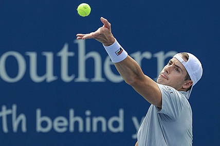 Aug 17, 2021; Mason, OH, USA; John Isner (USA) serves the ball against Cameron Norrie (GBR) during the Western and Southern Open tennis tournament at Lindner Family Tennis Center. Mandatory Credit: Aaron Doster-USA TODAY Sports