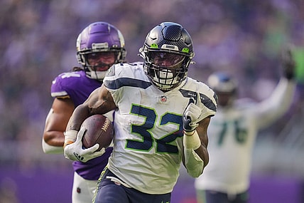 Sep 26, 2021; Minneapolis, Minnesota, USA; Seattle Seahawks running back Chris Carson (32) scores a touchdown against the Minnesota Vikings in the second quarter at U.S. Bank Stadium. Mandatory Credit: Brad Rempel-USA TODAY Sports