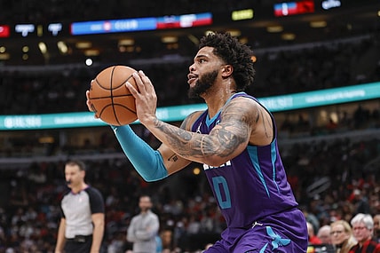 Apr 8, 2022; Chicago, Illinois, USA; Charlotte Hornets forward Miles Bridges (0) shoots against the Chicago Bulls during the second half at United Center. Mandatory Credit: Kamil Krzaczynski-USA TODAY Sports