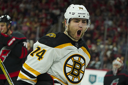 May 14, 2022; Raleigh, North Carolina, USA; Boston Bruins left wing Jake DeBrusk (74) celebrates his goal against the Carolina Hurricanes during the second period in game seven of the first round of the 2022 Stanley Cup Playoffs at PNC Arena. Mandatory Credit: James Guillory-USA TODAY Sports