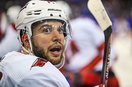 May 24, 2022; New York, New York, USA; Carolina Hurricanes defenseman Tony DeAngelo (77) catches this breath on the bench during a timeout against the New York Rangers during the third period in game four of the second round of the 2022 Stanley Cup Playoffs at Madison Square Garden. Mandatory Credit: Danny Wild-USA TODAY Sports