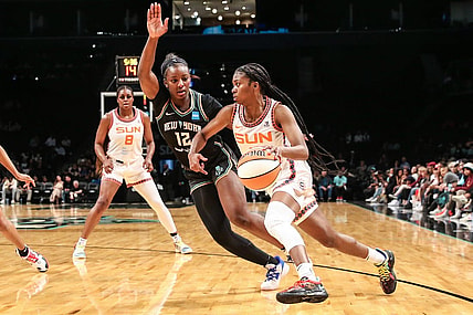 May 17, 2022; Brooklyn, New York, USA;  Connecticut Sun guard Nia Clouden (11) and New York Liberty forward Michaela Onyenwere (12) at Barclays Center. Mandatory Credit: Wendell Cruz-USA TODAY Sports