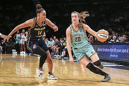 Jun 1, 2022; Brooklyn, New York, USA; New York Liberty guard Sabrina Ionescu (20) drives past Indiana Fever guard Bria Hartley (14) in the third quarter at Barclays Center. Mandatory Credit: Wendell Cruz-USA TODAY Sports