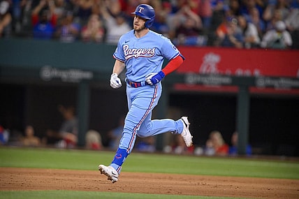 Jun 5, 2022; Arlington, Texas, USA; Texas Rangers designated hitter Mitch Garver (18) rounds the bases after he hits a two run home run against the Seattle Mariners during the eighth inning at Globe Life Field. Mandatory Credit: Jerome Miron-USA TODAY Sports