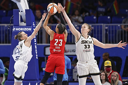 Jun 17, 2022; Chicago, Illinois, USA; Atlanta Dream guard Asia Durr (23) shoots against Chicago Sky guard Allie Quigley (14) and forward Emma Meesseman (33) during the second half of a WNBA game at Wintrust Arena. Mandatory Credit: Kamil Krzaczynski-USA TODAY Sports