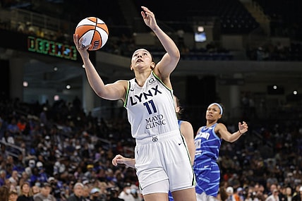 Jun 26, 2022; Chicago, Illinois, USA; Minnesota Lynx forward Natalie Achonwa (11) goes to the basket against the Chicago Sky during the second half of a WNBA game at Wintrust Arena. Mandatory Credit: Kamil Krzaczynski-USA TODAY Sports