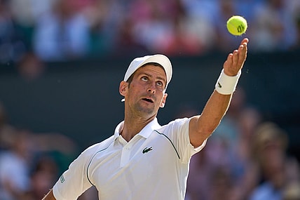 Jul 8, 2022; London, England, United Kingdom;  Novak Djokovic (SRB) serves during his semi finals men s singles match against Cameron Norrie (GBR) on Centre court at All England Lawn Tennis and Croquet Club. Mandatory Credit: Peter van den Berg-USA TODAY Sports