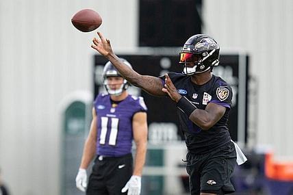 Jul 27, 2022; Owings Mills, MD, USA; Baltimore Ravens quarterback Lamar Jackson (8) throws the ball during day one of training camp at Under Armour Performance Center. Mandatory Credit: Jessica Rapfogel-USA TODAY Sports