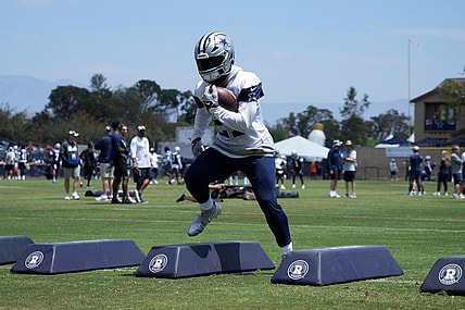 Jul 27, 2022; Oxnard, CA, USA; Dallas Cowboys running back Ezekiel Elliott (21) carries the ball during training camp at the River Ridge Fields. Mandatory Credit: Kirby Lee-USA TODAY Sports