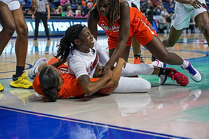Mar 6, 2020; Greensboro, NC, UCA; Louisville Cardinals guard Jazmine Jones (23) tries to maintain possession against the Syracuse Orange during the first half at Greensboro Coliseum. Mandatory Credit: Jim Dedmon-USA TODAY Sports
