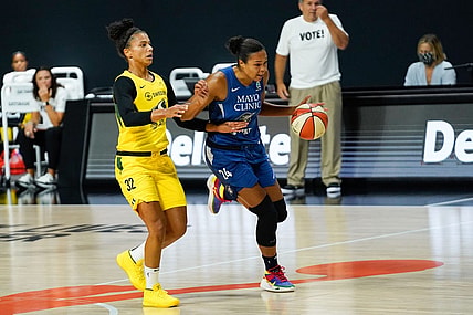 Sep 22, 2020; Bradenton, Florida, USA; Minnesota Lynx forward Napheesa Collier (24) dribbles the ball as Seattle Storm forward Alysha Clark (32) defends during the first half at IMG Academy. Mandatory Credit: Douglas DeFelice-USA TODAY Sports