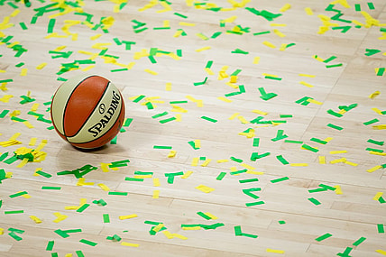 Oct 6, 2020; Bradenton, Florida, USA; A game ball rests on the court amidst green and yellow confetti after the Seattle Storm win the 2020 WNBA Finals at IMG Academy. Mandatory Credit: Mary Holt-USA TODAY Sports