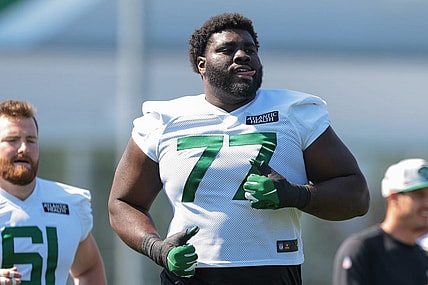 Jul 31, 2021; Florham Park, NJ, USA; New York Jets offensive tackle Mekhi Becton (77) runs during training camp at Atlantic Health Jets Training Center. Mandatory Credit: Vincent Carchietta-USA TODAY Sports