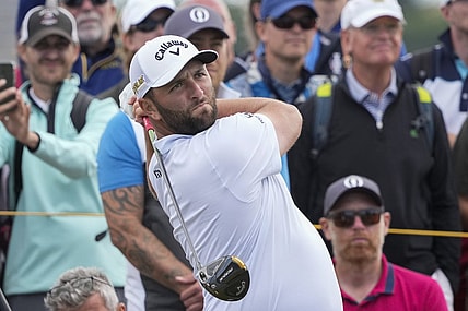Jul 12, 2022; St. Andrews,Fife, SCT; Jon Rahm hits his tee shot on the 5th hole during a practice round for the 150th Open Championship golf tournament at St. Andrews Old Course. Mandatory Credit: Michael Madrid-USA TODAY Sports