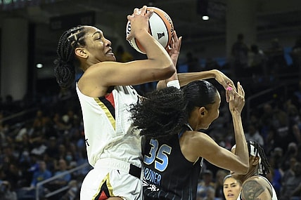 Jul 26, 2022; Chicago, IL, USA;  Las Vegas Aces forward A'ja Wilson (22), left, fights for the ball against Chicago Sky guard Rebekah Gardner (35) during the first half of the Commissioners Cup-Championships at Wintrust Arena. Mandatory Credit: Matt Marton-USA TODAY Sports