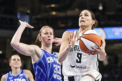 Jul 29, 2022; Chicago, Illinois, USA; New York Liberty guard Rebecca Allen (9) goes to the basket against Chicago Sky forward Emma Meesseman (33) during the second half of the WNBA game at Wintrust Arena. Mandatory Credit: Kamil Krzaczynski-USA TODAY Sports