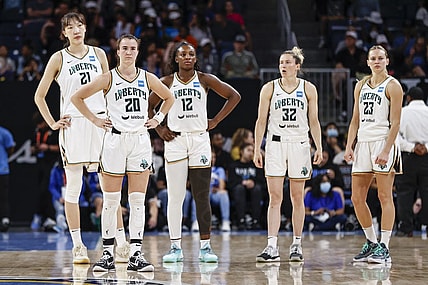 Jul 29, 2022; Chicago, Illinois, USA; New York Liberty center Han Xu (21), guard Sabrina Ionescu (20), forward Michaela Onyenwere (12), guard Sami Whitcomb (32) and guard Marine Johannes (23) stand on the court during the second half of the WNBA game against the Chicago Sky at Wintrust Arena. Mandatory Credit: Kamil Krzaczynski-USA TODAY Sports