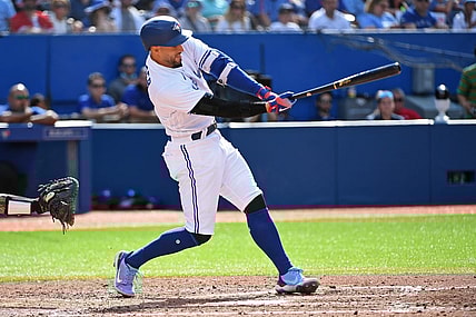 Jul 30, 2022; Toronto, Ontario, CAN; Toronto Blue Jays designated hitter George Springer (4) hits a fielders choice single in the sixth inning again the Detroit Tigers at Rogers Centre. Mandatory Credit: Gerry Angus-USA TODAY Sports