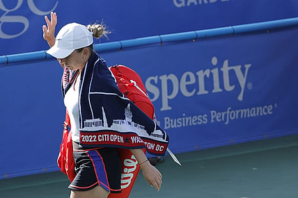 Aug 3, 2022; Washington, DC, USA; Simona Halep (ROU) waves to the crowd while leaving the court after retiring from her match against Anna Kaliskaya (not pictured) on day three of the Citi Open at Rock Creek Park Tennis Center. Mandatory Credit: Geoff Burke-USA TODAY Sports
