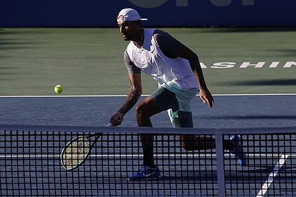 Aug 7, 2022; Washington, DC, USA; Nick Kyrgios (AUS) hits a volley against Yoshihito Nishioka (JPN) (not pictured) in the men's singles final on day seven of the Citi Open at Rock Creek Park Tennis Center. Mandatory Credit: Geoff Burke-USA TODAY Sports