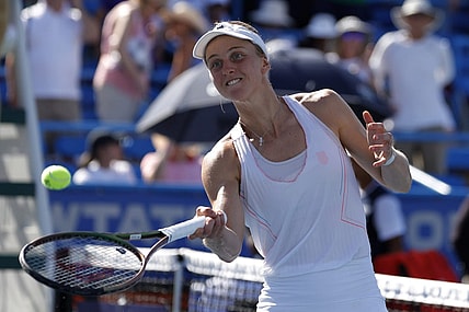 Aug 7, 2022; Washington, DC, USA; Liudmila Samsonova balls celebrates by hitting balls into the stands after her match against Kaia Kanepi (EST) (not pictured) in the women's singles final on day seven of the Citi Open at Rock Creek Park Tennis Center. Mandatory Credit: Geoff Burke-USA TODAY Sports