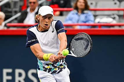 Aug 8, 2022; Montreal, Quebec, Canada; Emil Ruusuvuori (FIN) hits a shot against Stan Wawrinka (SUI) (not pictured)  during first round play at IGA Stadium. Mandatory Credit: David Kirouac-USA TODAY Sports