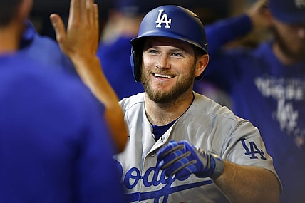 Aug 17, 2022; Milwaukee, Wisconsin, USA;  Los Angeles Dodgers third baseman Max Muncy (13) celebrates after hitting a home run during the seventh inning against the Milwaukee Brewers at American Family Field. Mandatory Credit: Jeff Hanisch-USA TODAY Sports
