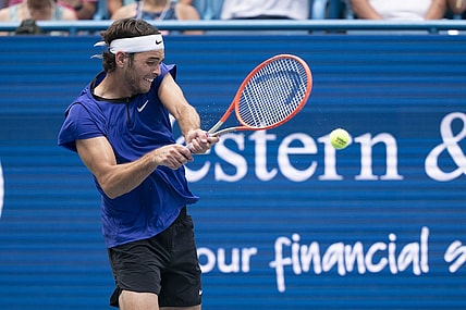 Aug 19, 2022; Cincinnati, OH, USA; Taylor Fritz (USA) returns a shot during his match against Daniil Medvedev (RUS) at the Western & Southern Open at the Lindner Family Tennis Center. Mandatory Credit: Susan Mullane-USA TODAY Sports