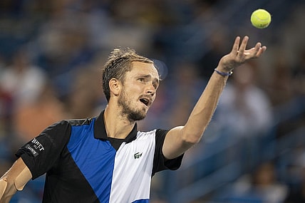 Aug 20, 2022; Cincinnati, OH, USA; Daniil Medvedev (RUS) serves against Stefanos Tsitsipas (GRE) at the Western & Southern Open at the Lindner Family Tennis Center. Mandatory Credit: Susan Mullane-USA TODAY Sports