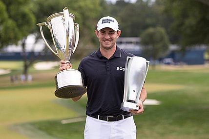 Aug 21, 2022; Wilmington, Delaware, USA; Patrick Cantlay poses with the BMW and Western Golf Association trophies after winning the BMW Championship golf tournament. Mandatory Credit: Bill Streicher-USA TODAY Sports
