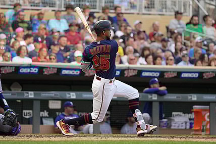 Aug 22, 2022; Minneapolis, Minnesota, USA; Minnesota Twins center fielder Byron Buxton (25) hits a single during the third inning against the Texas Rangers at Target Field. Mandatory Credit: Jordan Johnson-USA TODAY Sports