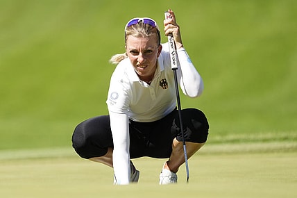 Aug 5, 2021; Tokyo, Japan; Sophia Popov (GER) prepares to putt on the fourth green during the second round of the women's individual stroke play of the Tokyo 2020 Olympic Summer Games at Kasumigaseki Country Club. Mandatory Credit: Michael Madrid-USA TODAY Sports