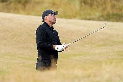 Jul 14, 2022; St. Andrews, SCT; Phil Mickelson takes a shot on the fifth fairway during the first round of the 150th Open Championship golf tournament at St. Andrews Old Course. Mandatory Credit: Rob Schumacher-USA TODAY Sports