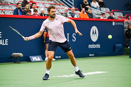 Aug 8, 2022; Montreal, Quebec, Canada; Stan Wawrinka (SUI) hits a shot against Emil Ruusuvuori (FIN) (not pictured) during first round play at IGA Stadium. Mandatory Credit: David Kirouac-USA TODAY Sports