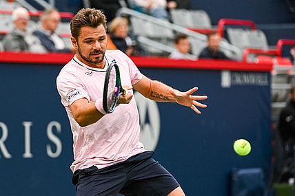 Aug 8, 2022; Montreal, Quebec, Canada; Stan Wawrinka (SUI) hits a shot against Emil Ruusuvuori (FIN) (not pictured) during first round play at IGA Stadium. Mandatory Credit: David Kirouac-USA TODAY Sports