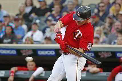 Aug 15, 2022; Minneapolis, Minnesota, USA; Minnesota Twins right fielder Max Kepler (26) hits an RBI single against the Kansas City Royals in the second inning at Target Field. Mandatory Credit: Bruce Kluckhohn-USA TODAY Sports